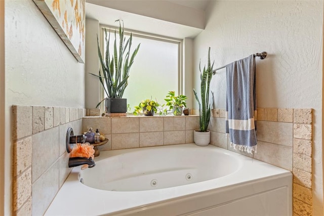 13141 Austrian Pine Dr, Choctaw, OK 73020 - bathroom with a whirlpool tub and a textured wall
