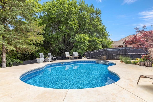 13141 Austrian Pine Dr, Choctaw, OK 73020 - view of swimming pool featuring a patio and a fenced backyard
