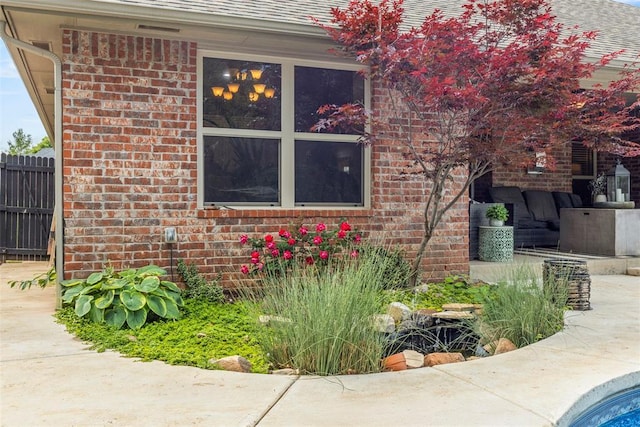 13141 Austrian Pine Dr, Choctaw, OK 73020 - view of property exterior with brick siding, fence, and roof with shingles