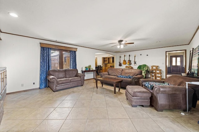 3926 Briarcrest Dr, Norman, OK 73072 - living area with arched walkways, plenty of natural light, ceiling fan, light tile patterned flooring, and crown molding