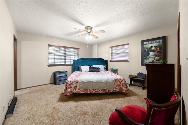 3926 Briarcrest Dr, Norman, OK 73072 - bedroom with carpet floors, a textured ceiling, ceiling fan, and baseboards