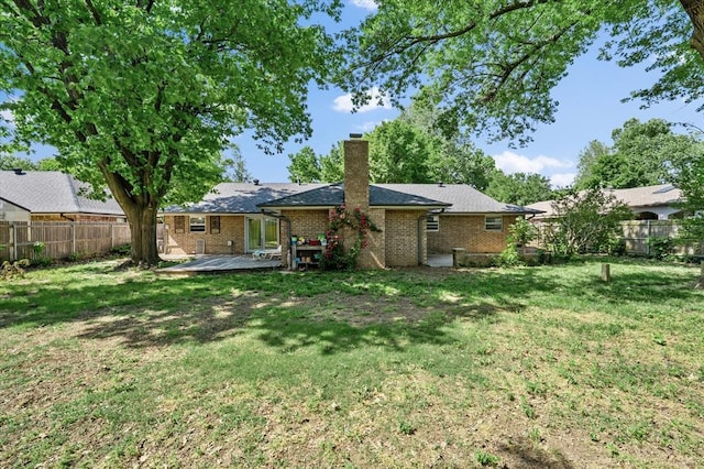 3926 Briarcrest Dr, Norman, OK 73072 - rear view of property featuring a chimney, brick siding, and a wooden deck