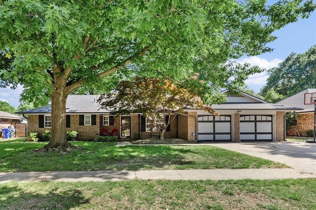 3926 Briarcrest Dr, Norman, OK 73072 - view of front of house with a garage, a front lawn, concrete driveway, and brick siding