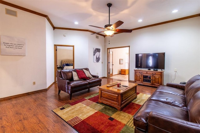 717 Hunters Run, Midwest City, OK 73130 - living area with crown molding, ceiling fan, wood finished floors, recessed lighting, and baseboards