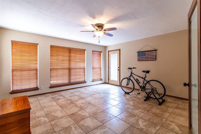 717 Hunters Run, Midwest City, OK 73130 - spare room with a ceiling fan, baseboards, and light tile patterned floors