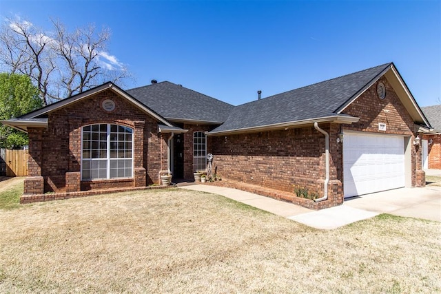 717 Hunters Run, Midwest City, OK 73130 - ranch-style home with roof with shingles, brick siding, an attached garage, and driveway