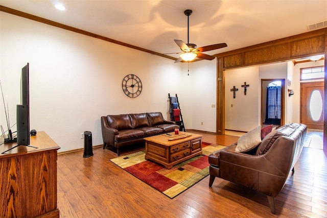 717 Hunters Run, Midwest City, OK 73130 - living area with ceiling fan, crown molding, wood finished floors, and baseboards