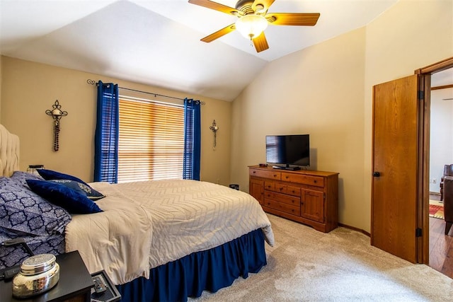 717 Hunters Run, Midwest City, OK 73130 - bedroom featuring vaulted ceiling, light carpet, and ceiling fan
