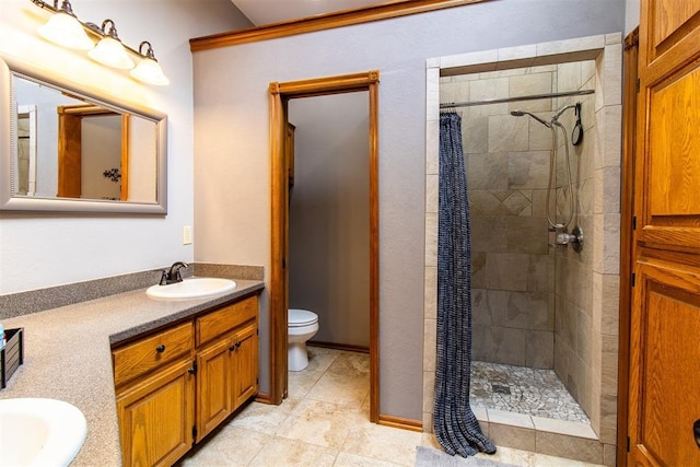 717 Hunters Run, Midwest City, OK 73130 - bathroom featuring a tile shower, vanity, toilet, and tile patterned floors