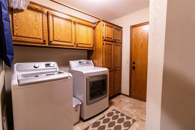 717 Hunters Run, Midwest City, OK 73130 - laundry room with cabinet space and washer and dryer