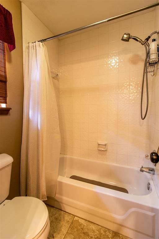 717 Hunters Run, Midwest City, OK 73130 - bathroom featuring toilet, tile patterned floors, and shower / tub combo