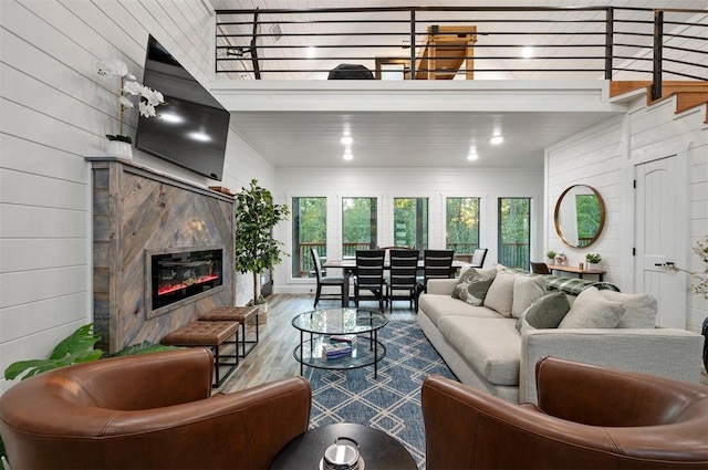 48 Cedar Hills Trl, Broken Bow, OK 74728 - living area with wood finished floors, wooden walls, and a high end fireplace