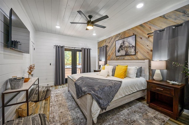 48 Cedar Hills Trl, Broken Bow, OK 74728 - bedroom featuring french doors, wooden walls, wood finished floors, recessed lighting, and access to exterior