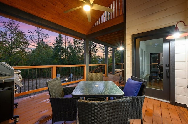 48 Cedar Hills Trl, Broken Bow, OK 74728 - deck at dusk with ceiling fan, outdoor dining area, and a grill