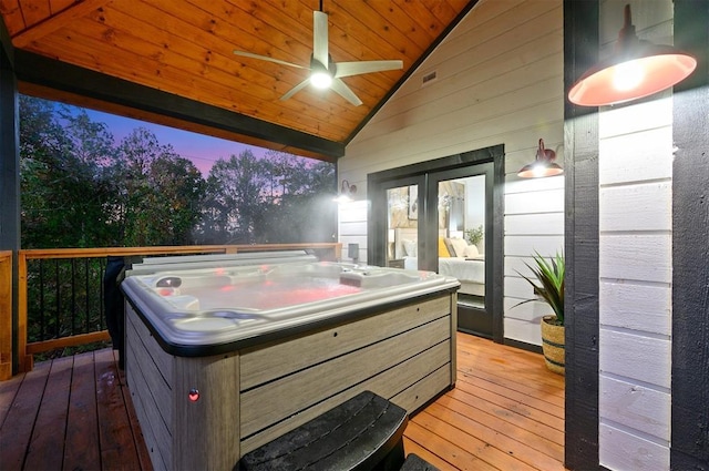 48 Cedar Hills Trl, Broken Bow, OK 74728 - deck at dusk with a hot tub, a ceiling fan, and french doors