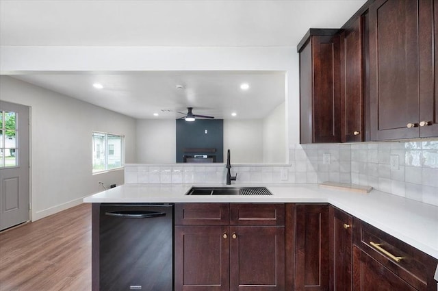 825 W Colorado Ave, Chickasha, OK 73018 - kitchen with a sink, black dishwasher, healthy amount of natural light, light countertops, and recessed lighting