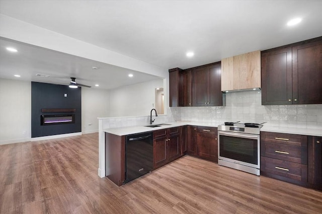 825 W Colorado Ave, Chickasha, OK 73018 - kitchen featuring stainless steel electric stove, dishwasher, a sink, light countertops, and recessed lighting