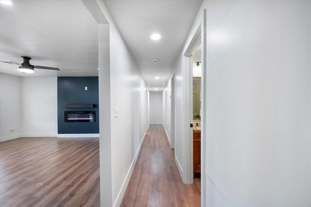 825 W Colorado Ave, Chickasha, OK 73018 - hall with wood finished floors, baseboards, and recessed lighting