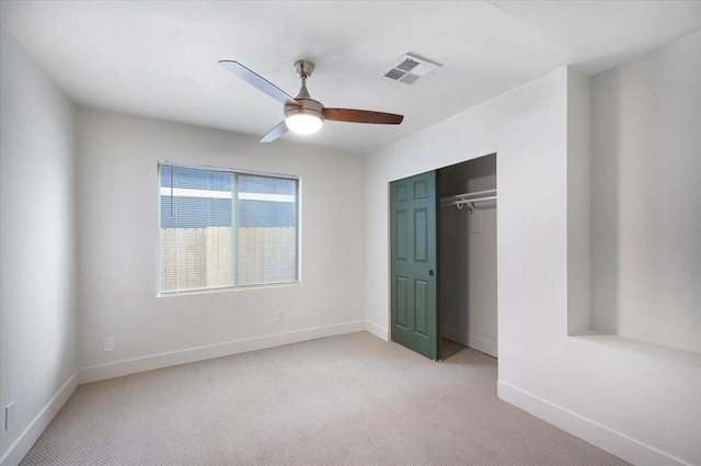 825 W Colorado Ave, Chickasha, OK 73018 - unfurnished bedroom featuring light colored carpet, baseboards, and a closet