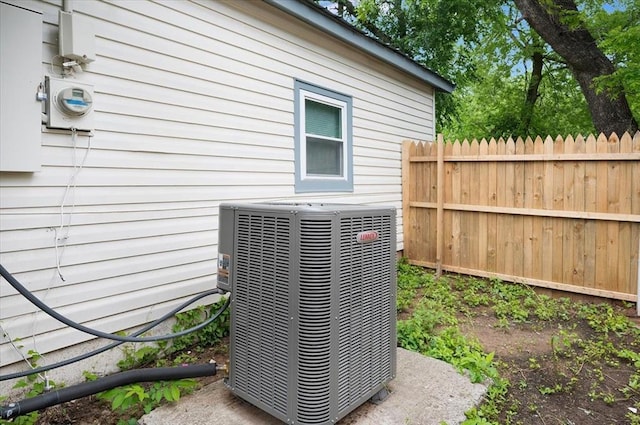 825 W Colorado Ave, Chickasha, OK 73018 - exterior view of central air condition unit, fence, and electric meter