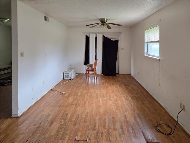 3401 SW Abilene Dr, Lawton, OK 73501 - spare room featuring light wood finished floors, ceiling fan, and a textured ceiling