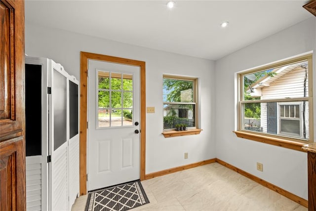 entryway featuring baseboards and recessed lighting