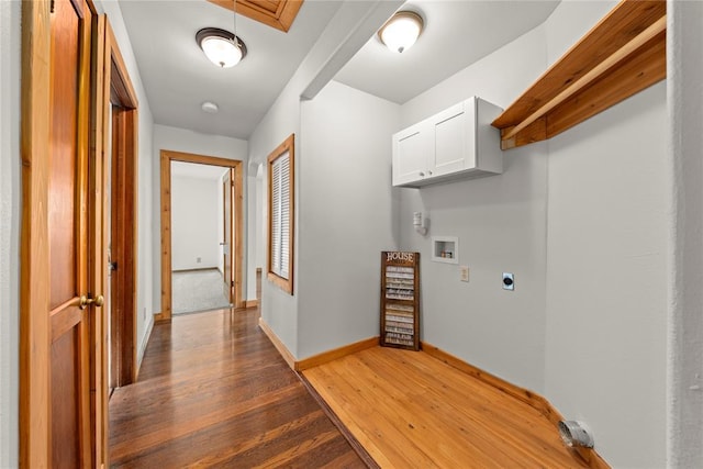 clothes washing area featuring electric dryer hookup, hookup for a washing machine, light wood-style flooring, cabinet space, and baseboards