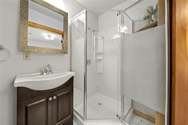 full bath featuring a stall shower and vanity