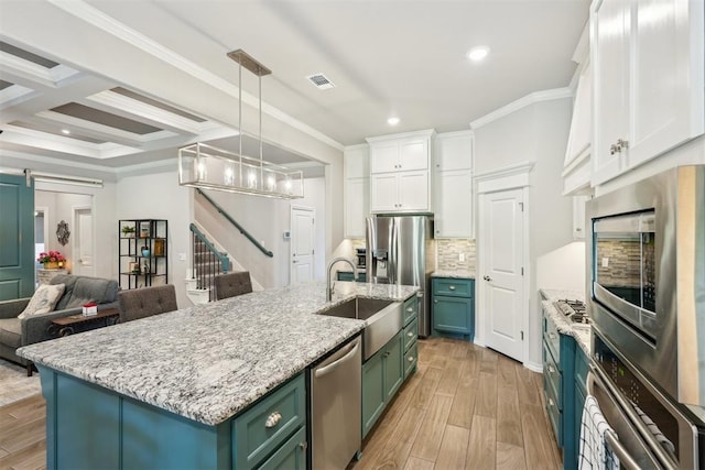 8400 Poplar Dr, Edmond, OK 73034 - kitchen featuring green cabinets, appliances with stainless steel finishes, white cabinetry, recessed lighting, and backsplash