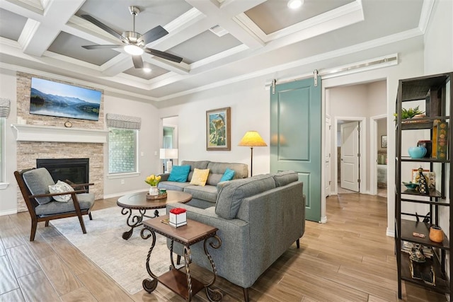 8400 Poplar Dr, Edmond, OK 73034 - living room with a ceiling fan, a barn door, light wood-style floors, beamed ceiling, and coffered ceiling
