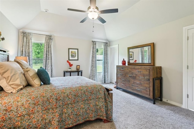 8400 Poplar Dr, Edmond, OK 73034 - bedroom with multiple windows, vaulted ceiling, carpet, and a ceiling fan