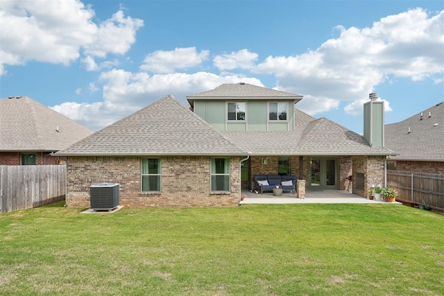 8400 Poplar Dr, Edmond, OK 73034 - rear view of property featuring a fenced backyard, a patio area, a shingled roof, an outdoor living space, and a chimney