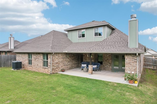 8400 Poplar Dr, Edmond, OK 73034 - rear view of property featuring a chimney, brick siding, a shingled roof, and a patio