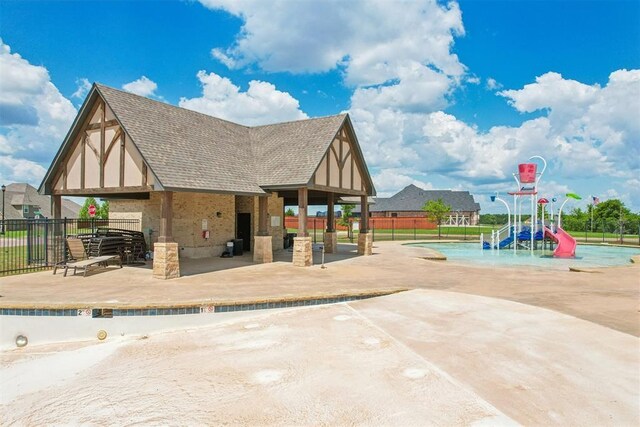 8400 Poplar Dr, Edmond, OK 73034 - view of jungle gym featuring a water play area, a patio, and a gazebo