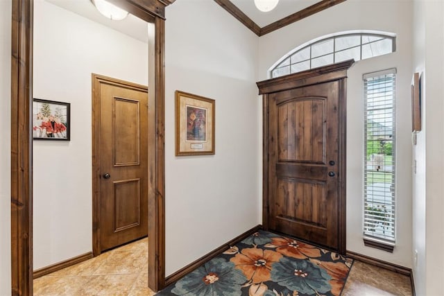 12812 NW 6th St, Yukon, OK 73099 - foyer featuring baseboards, light tile patterned flooring, and ornamental molding