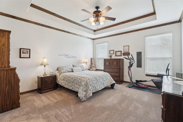 12812 NW 6th St, Yukon, OK 73099 - bedroom featuring light colored carpet, crown molding, a tray ceiling, and baseboards