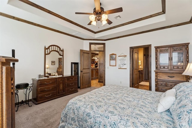 12812 NW 6th St, Yukon, OK 73099 - bedroom with a raised ceiling, light carpet, crown molding, connected bathroom, and baseboards