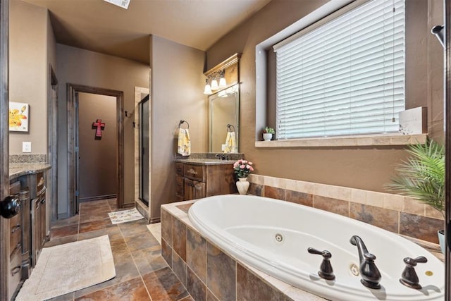 12812 NW 6th St, Yukon, OK 73099 - bathroom featuring vanity, a tub with jets, a shower stall, and stone finish floors