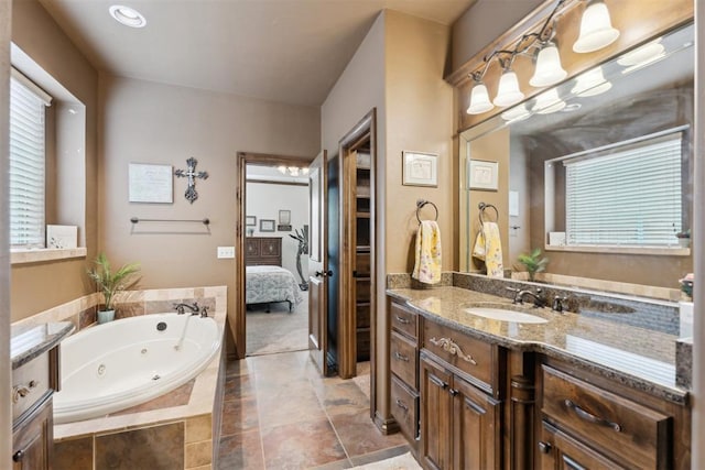 12812 NW 6th St, Yukon, OK 73099 - bathroom with ensuite bath, vanity, and a tub with jets