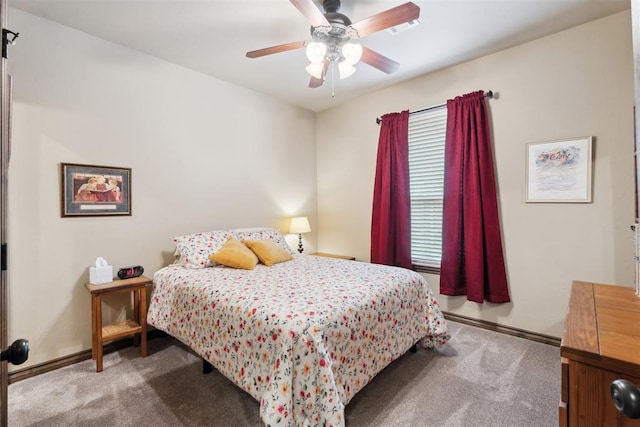12812 NW 6th St, Yukon, OK 73099 - bedroom with carpet, baseboards, ceiling fan, and a baseboard radiator