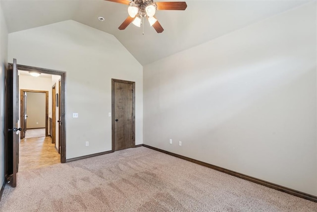 12812 NW 6th St, Yukon, OK 73099 - unfurnished bedroom featuring light colored carpet, baseboards, a ceiling fan, and high vaulted ceiling