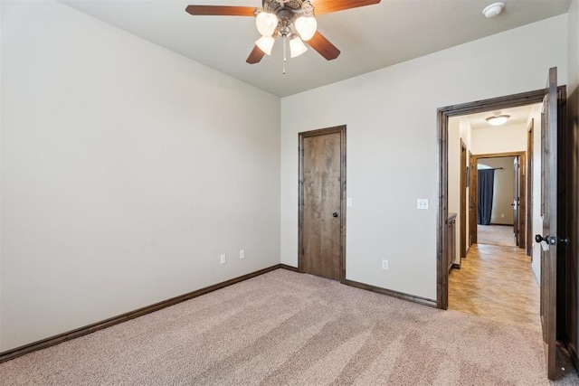 12812 NW 6th St, Yukon, OK 73099 - unfurnished bedroom featuring light colored carpet, baseboards, and a ceiling fan