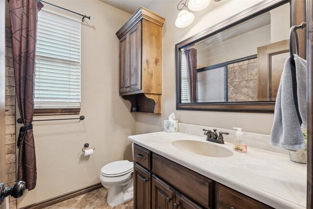 12812 NW 6th St, Yukon, OK 73099 - full bath featuring toilet, vanity, a shower, and baseboards