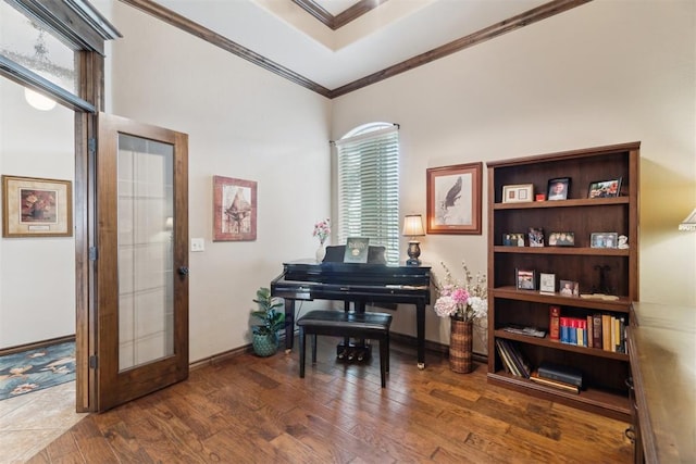 12812 NW 6th St, Yukon, OK 73099 - living area with crown molding, wood finished floors, and baseboards