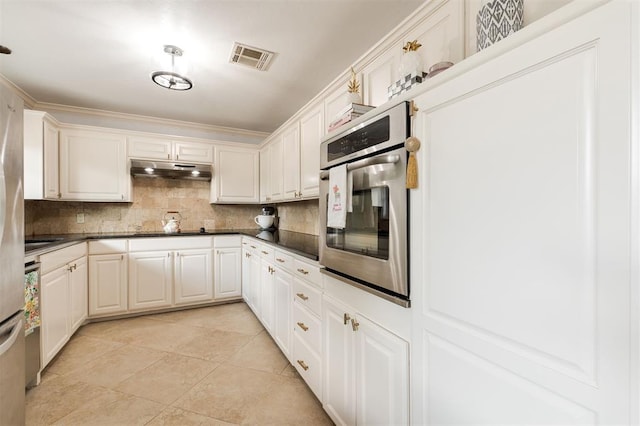 2728 Kerry Ln, Oklahoma City, OK 73120 - kitchen featuring stainless steel oven, backsplash, dark countertops, and under cabinet range hood