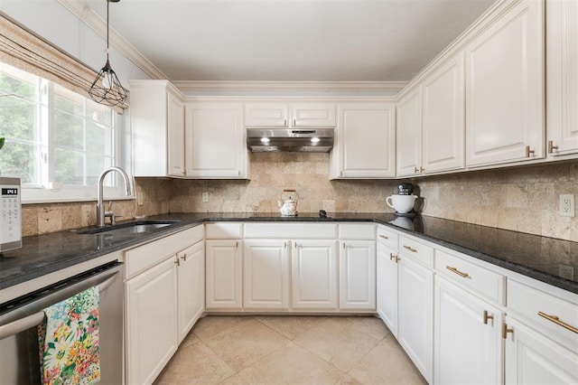 2728 Kerry Ln, Oklahoma City, OK 73120 - kitchen with stainless steel dishwasher, under cabinet range hood, tasteful backsplash, hanging light fixtures, and white cabinetry