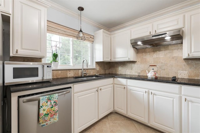 2728 Kerry Ln, Oklahoma City, OK 73120 - kitchen with under cabinet range hood, white microwave, stainless steel dishwasher, tasteful backsplash, and decorative light fixtures