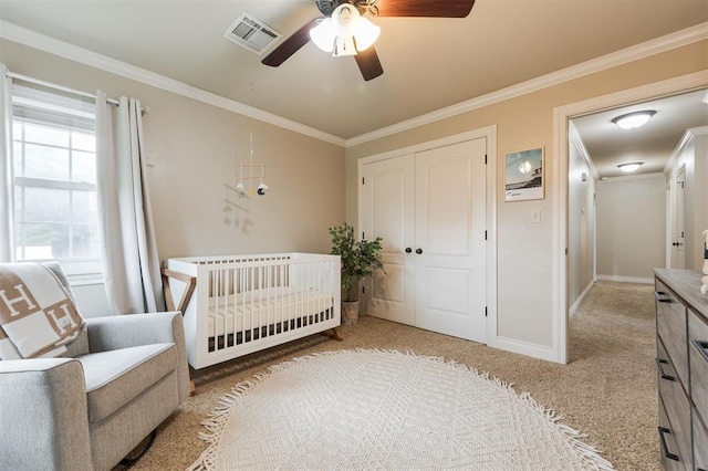 2728 Kerry Ln, Oklahoma City, OK 73120 - bedroom with light carpet, crown molding, a closet, a nursery area, and ceiling fan