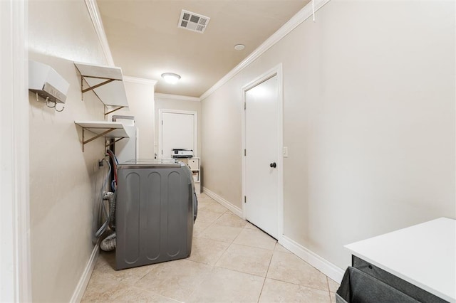 2728 Kerry Ln, Oklahoma City, OK 73120 - laundry area with ornamental molding and light tile patterned flooring
