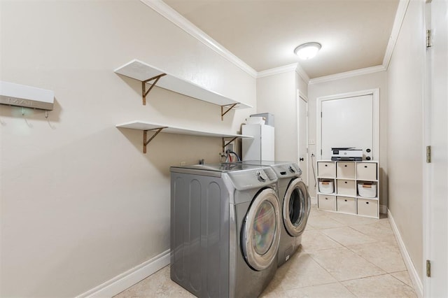 2728 Kerry Ln, Oklahoma City, OK 73120 - laundry room with washing machine and clothes dryer, ornamental molding, and light tile patterned floors